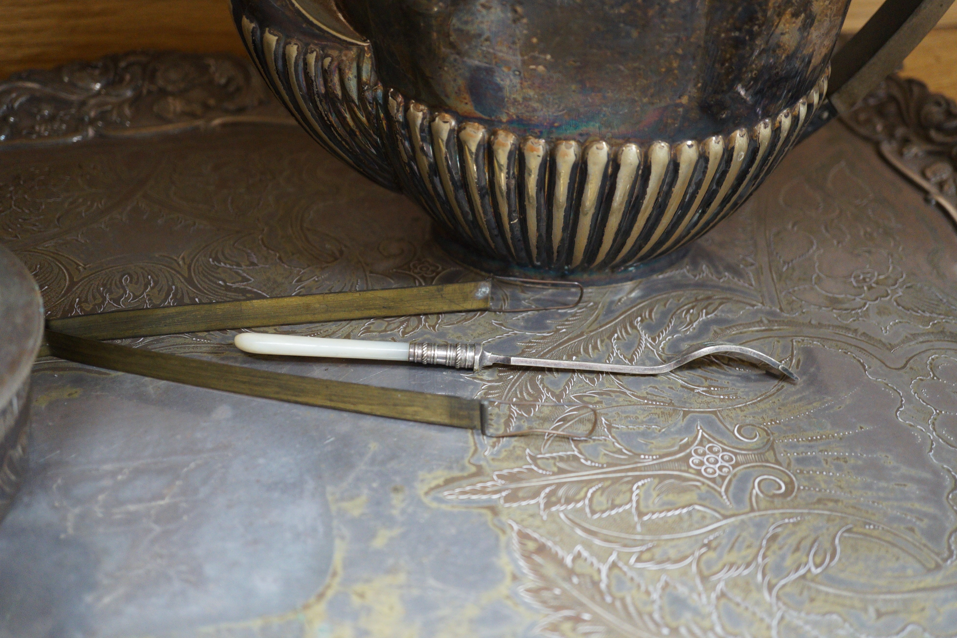 A silver plated two handled tea tray and seven other plated items, tray length 80cm